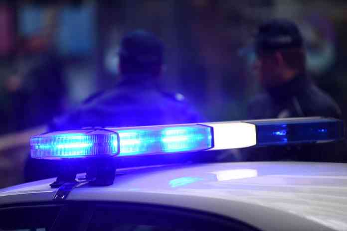 Police car with blue light. Police car with blue light.